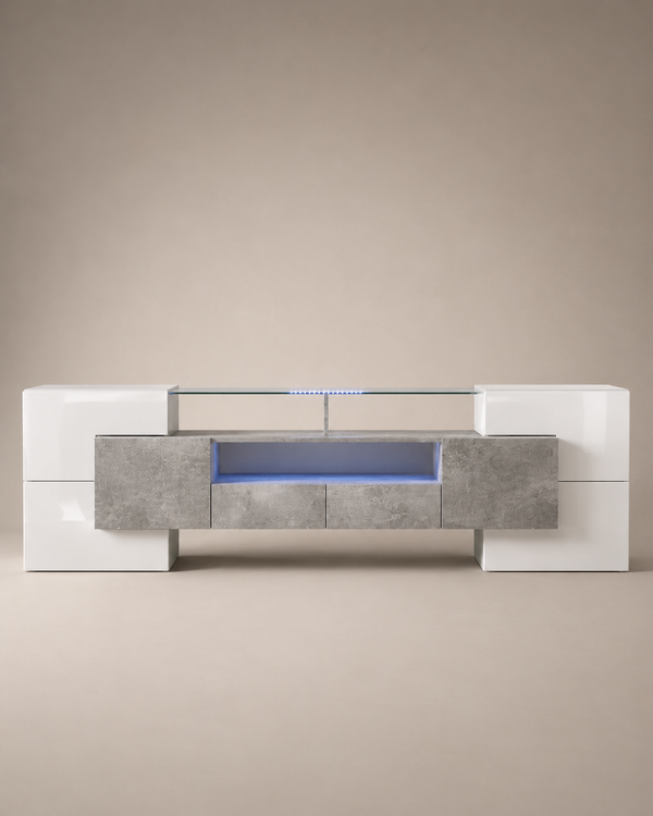 A modern low-profile media console with a glossy white high-gloss finish, textured gray stone-look front panels, and a glass top shelf illuminated by blue LED lighting, set against a neutral beige background.