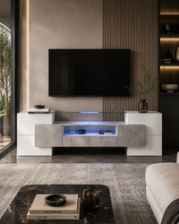 Modern floating TV console in a minimalist living room, featuring white and textured gray panels with a built-in blue LED light strip, set against a slatted wood accent wall with a mounted flat-screen TV.