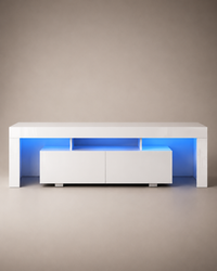 A modern white low-profile media console with built-in blue LED under-glow lighting, shown against a neutral beige studio background.