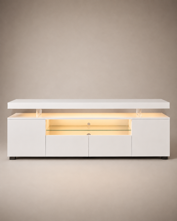 A modern white media console with a lift-top design, illuminated by warm yellow LED lighting inside. The cabinet features two side cabinets, two central drawers, and a glass shelf in the center, supported by clear acrylic pillars under the top surface.
