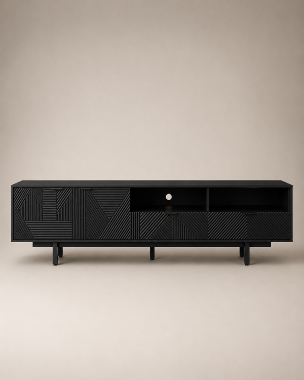 A modern black wooden media console with geometric carved panel details and open shelving, shown against a neutral beige background.
