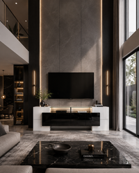 A modern living room interior with a black flat-screen TV mounted on a dark stone wall above a white and black media console. The room features warm vertical LED strip lighting, a gray marble coffee table in the foreground, and large floor-to-ceiling windows on the right.