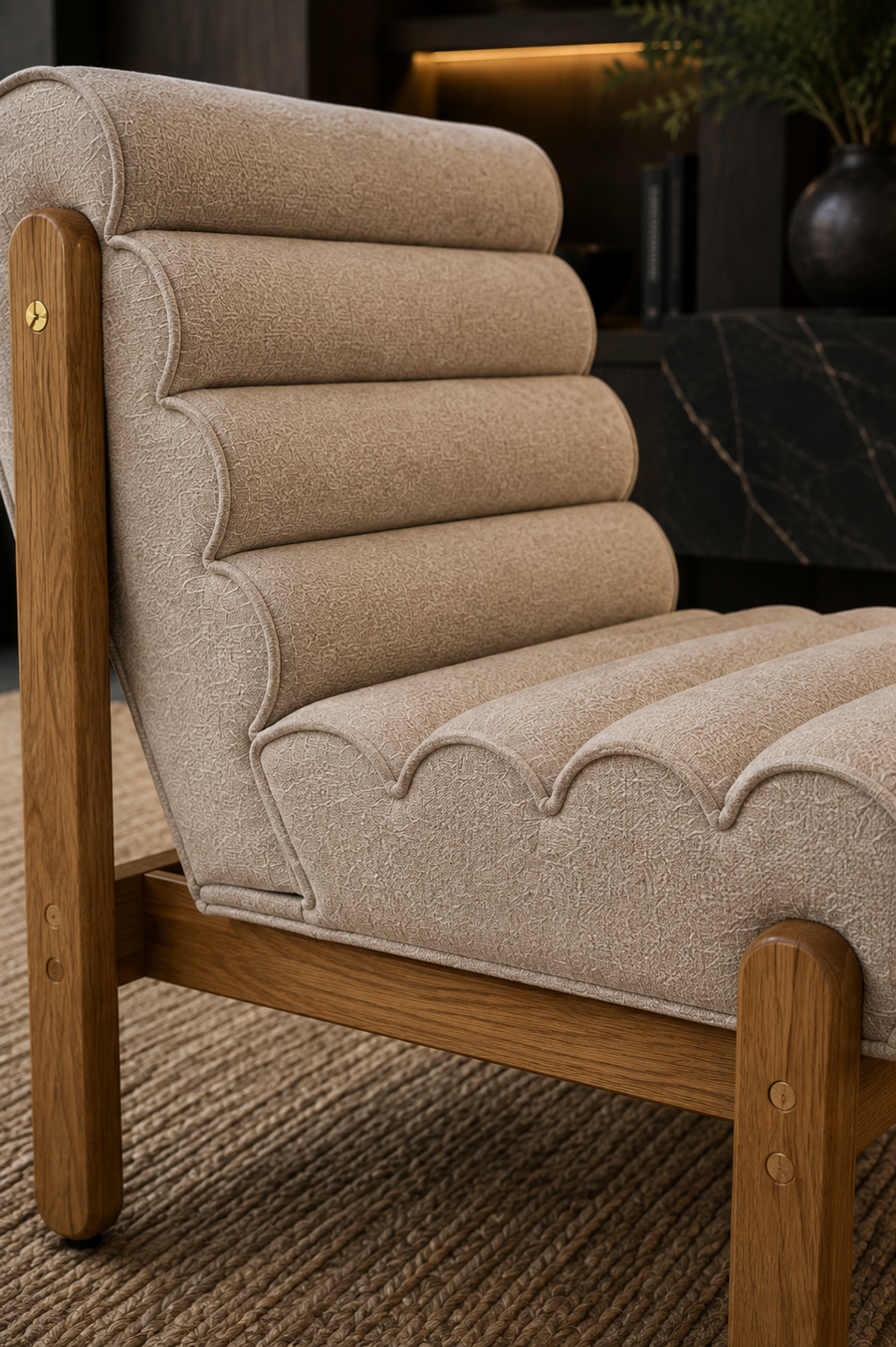 A close-up of a modern lounge chair with beige textured upholstery and a warm wood frame, set on a woven rug in a stylish interior.