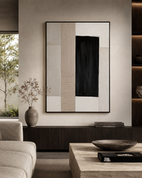 A large framed abstract wall art print hangs above a dark wood console in a modern living room. The artwork features a minimalist geometric design with vertical and horizontal blocks of black, off-white, beige, and light gray.