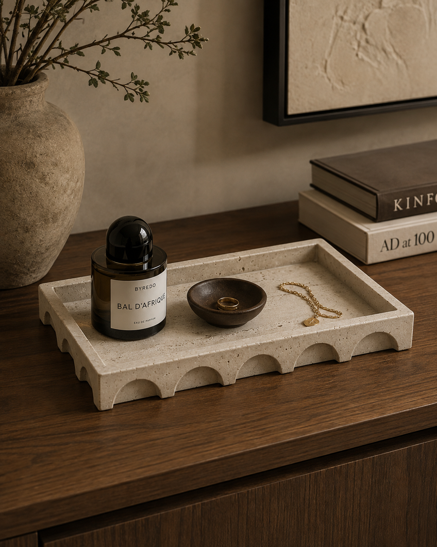Aurevia travertine decorative tray styled with refined accessories in a modern luxury interior