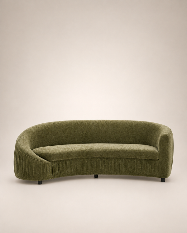 A curved, low-profile upholstered sofa in textured olive green fabric, shown against a plain light beige studio background.