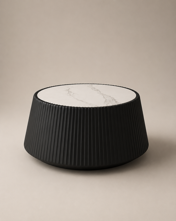 A modern black ribbed cylindrical side table with a white marble-patterned top, set against a solid beige background.