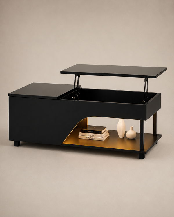 A modern black lift-top coffee table with a gold interior shelf, shown with the lid open to reveal the storage compartment. The table is styled with a stack of books and two small white vases on the lower shelf, set against a neutral beige background.