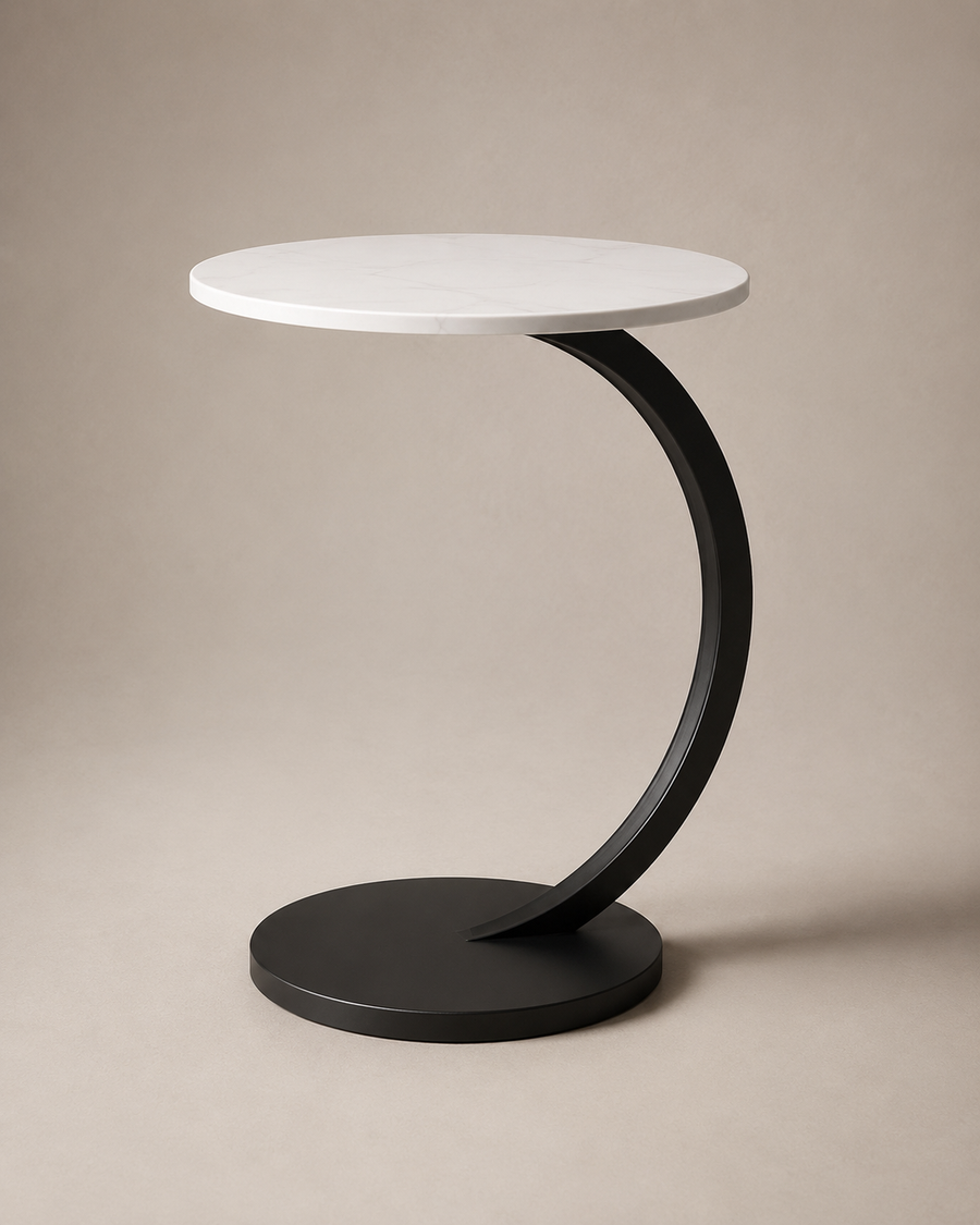 A modern side table with a round white top and a curved black metal base, photographed on a neutral beige studio background.