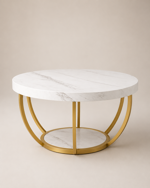 A round coffee table with a white marble top and base, supported by a gold-finished metal frame, set against a neutral beige background.